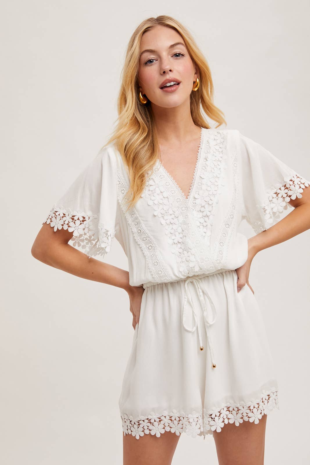 WRAP FLORAL LACE TRIMMED DRAWSTRING ROMPER: ALMOND